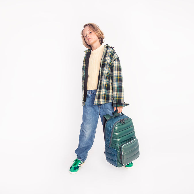 Boy wearing Jeune Premier New Bobbie Puffer Green school backpack, age 6 and up