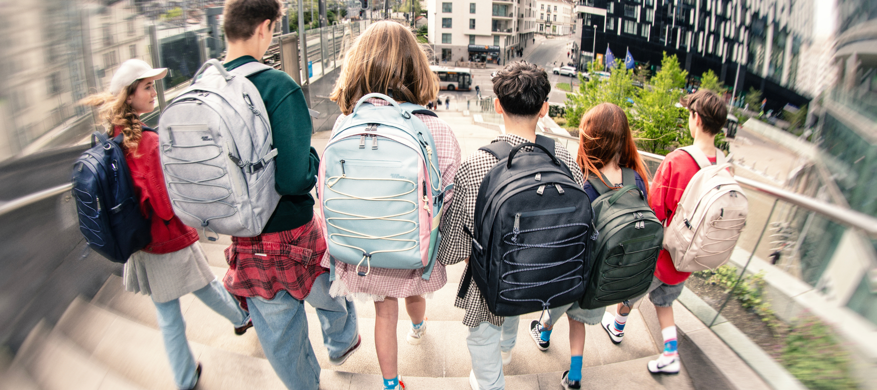 A group of teenagers wearing the new Jeune Premier College Backpack